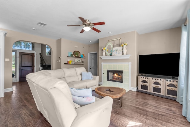 1 Cimarron Ct, Trophy Club, TX 76262 - living area featuring a ceiling fan, wood finished floors, a tiled fireplace, and stairs
