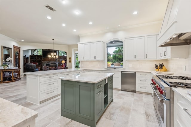 1801 Kinsale Dr, Keller, TX 76262 - kitchen with stainless steel appliances, white cabinetry, a chandelier, tasteful backsplash, and a peninsula