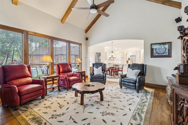 1801 Kinsale Dr, Keller, TX 76262 - living area featuring arched walkways, ceiling fan, high vaulted ceiling, beamed ceiling, and wood finished floors