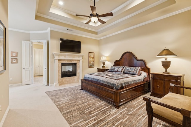 1801 Kinsale Dr, Keller, TX 76262 - bedroom featuring a raised ceiling, light colored carpet, a fireplace, crown molding, and ceiling fan