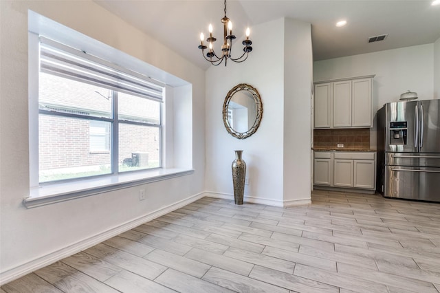 1015 Seider Ln, Grand Prairie, TX 75052 - unfurnished dining area featuring a chandelier, light wood finished floors, and recessed lighting