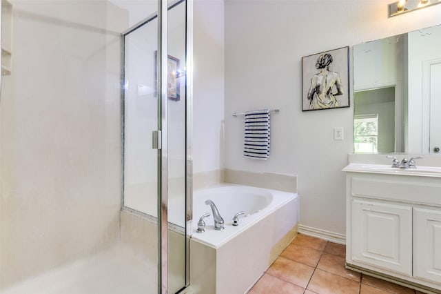 1015 Seider Ln, Grand Prairie, TX 75052 - full bath featuring a stall shower, a garden tub, vanity, and tile patterned floors