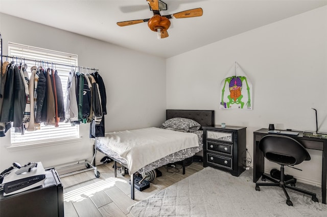 1015 Seider Ln, Grand Prairie, TX 75052 - bedroom with ceiling fan and wood finished floors