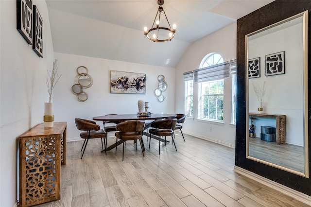 1015 Seider Ln, Grand Prairie, TX 75052 - dining space featuring a chandelier, vaulted ceiling, and light wood finished floors