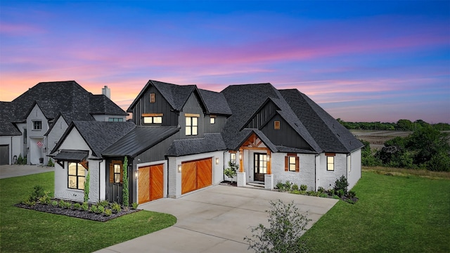 2028 Fox Bend Trce, Gunter, TX 75058 - modern farmhouse featuring concrete driveway, board and batten siding, a lawn, a shingled roof, and a standing seam roof