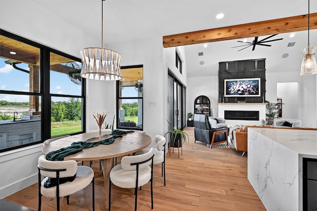 2028 Fox Bend Trce, Gunter, TX 75058 - dining area featuring beamed ceiling, light wood finished floors, a large fireplace, recessed lighting, and a ceiling fan