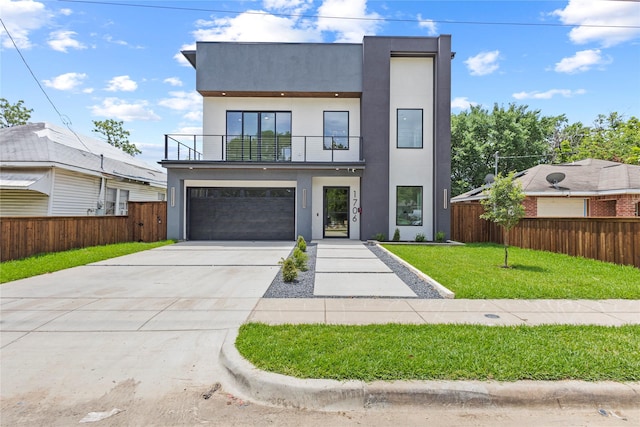 1706 Homeland St, Dallas, TX 75212 - contemporary home featuring a balcony, concrete driveway, stucco siding, and a garage
