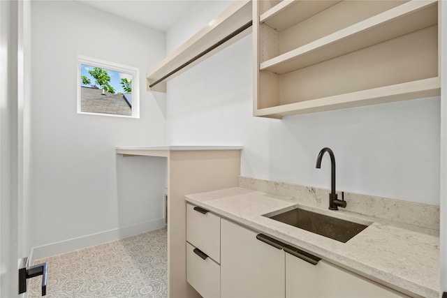 1706 Homeland St, Dallas, TX 75212 - laundry room featuring a sink and tile patterned floors