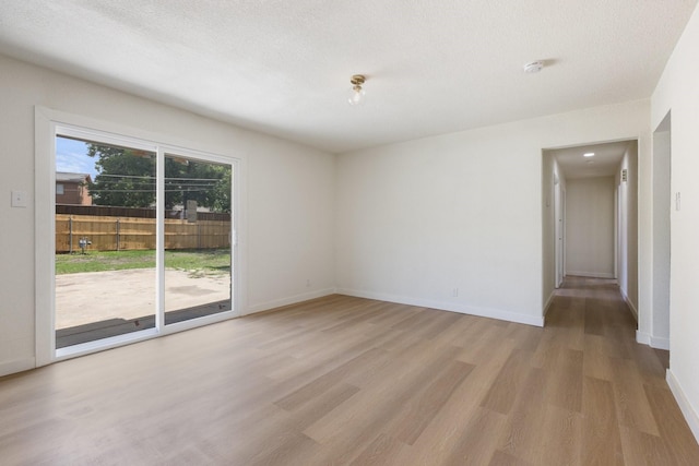 719 Sara Dr, Mesquite, TX 75149 - unfurnished room with light wood-style floors and baseboards