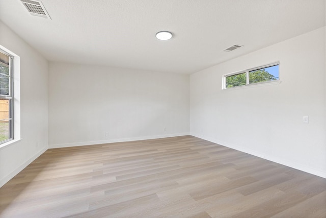 719 Sara Dr, Mesquite, TX 75149 - spare room with light wood-type flooring and baseboards