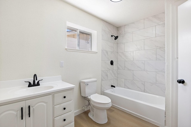 719 Sara Dr, Mesquite, TX 75149 - bathroom featuring wood finished floors,  shower combination, and vanity