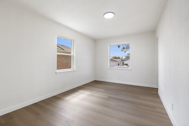 719 Sara Dr, Mesquite, TX 75149 - unfurnished room with plenty of natural light and wood finished floors
