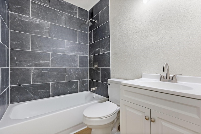 719 Sara Dr, Mesquite, TX 75149 - bathroom with a textured wall, vanity, and bathtub / shower combination