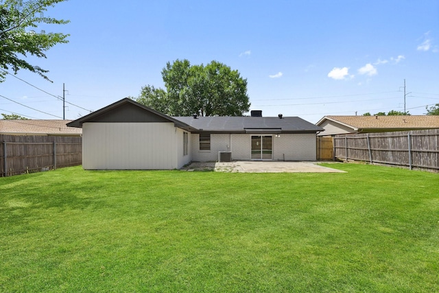 719 Sara Dr, Mesquite, TX 75149 - back of property with a patio, a fenced backyard, and brick siding