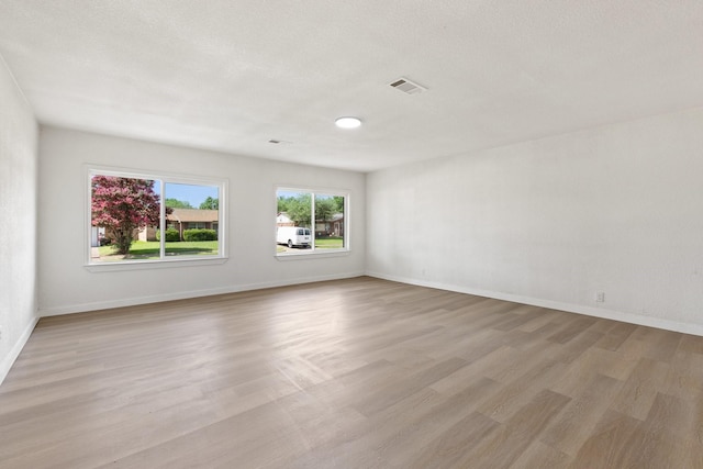 719 Sara Dr, Mesquite, TX 75149 - spare room featuring wood finished floors and baseboards