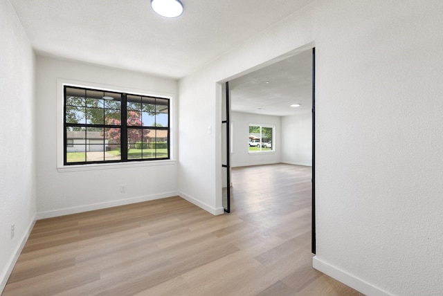 719 Sara Dr, Mesquite, TX 75149 - empty room featuring light wood finished floors and baseboards