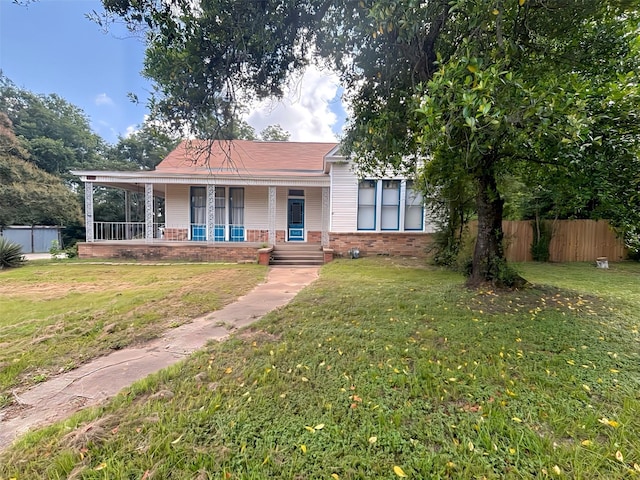 1915 N Jackson St, Palestine, TX 75803 - view of front of home featuring covered porch and brick siding