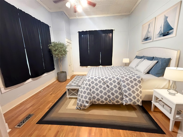 1915 N Jackson St, Palestine, TX 75803 - bedroom with wood finished floors, ornamental molding, and ceiling fan