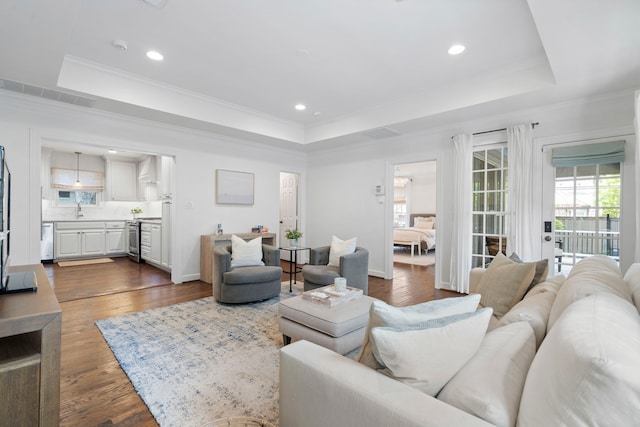 3216 Lovers Ln, University Park, TX 75225 - living room with a tray ceiling, dark wood-style floors, ornamental molding, and recessed lighting