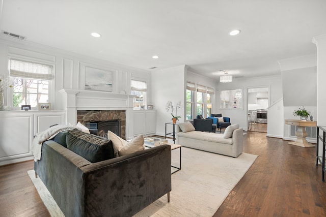 3216 Lovers Ln, University Park, TX 75225 - living room featuring crown molding, a stone fireplace, recessed lighting, and wood finished floors