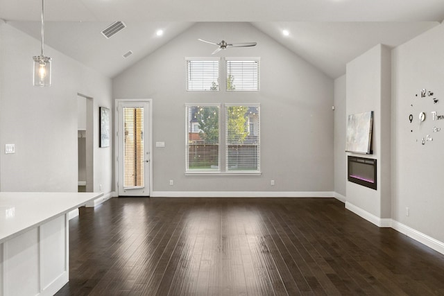 13313 Rembrandt Dr, Frisco, TX 75035 - unfurnished living room featuring a ceiling fan, high vaulted ceiling, dark wood-style flooring, and recessed lighting