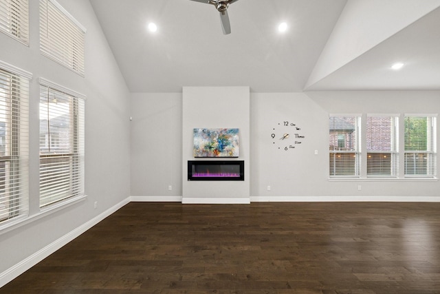13313 Rembrandt Dr, Frisco, TX 75035 - unfurnished living room featuring a glass covered fireplace, plenty of natural light, a ceiling fan, dark wood-style flooring, and recessed lighting