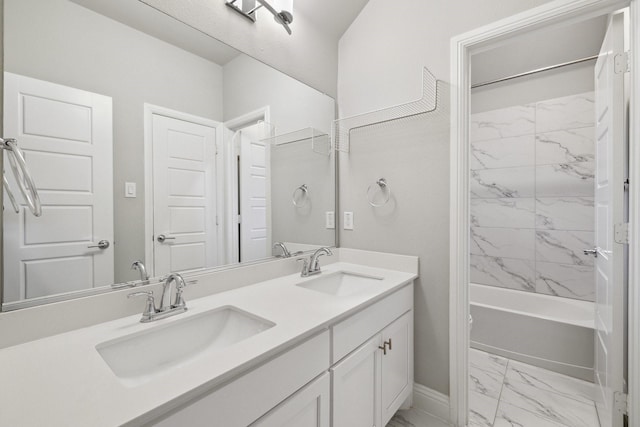 13313 Rembrandt Dr, Frisco, TX 75035 - bathroom with marble finish floors, double vanity, and bathing tub / shower combination