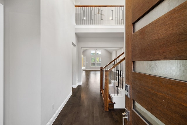 13313 Rembrandt Dr, Frisco, TX 75035 - corridor featuring dark wood-style floors, stairs, and a high ceiling