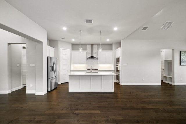 13313 Rembrandt Dr, Frisco, TX 75035 - kitchen featuring stainless steel appliances, wall chimney exhaust hood, light countertops, decorative backsplash, and white cabinets
