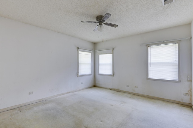 2408 Garden Ln, Arlington, TX 76015 - spare room with a textured ceiling, a ceiling fan, and carpet floors