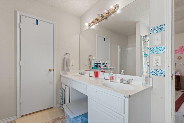 808 Elbe Dr, Arlington, TX 76001 - bathroom with double vanity, a textured ceiling, and tile patterned floors