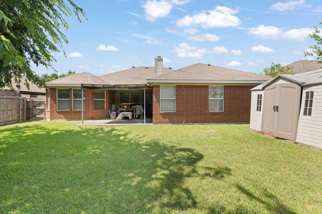 808 Elbe Dr, Arlington, TX 76001 - rear view of house featuring a patio area, a shed, a fenced backyard, brick siding, and a chimney