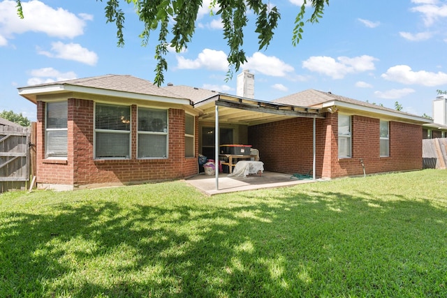 808 Elbe Dr, Arlington, TX 76001 - rear view of house featuring a chimney, a patio, and brick siding