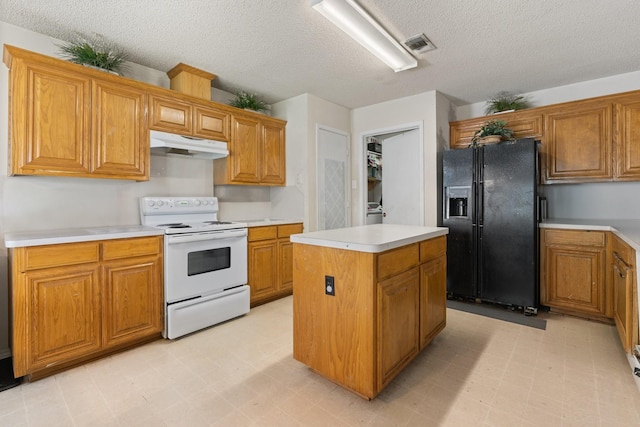 808 Elbe Dr, Arlington, TX 76001 - kitchen with electric range, black fridge with ice dispenser, under cabinet range hood, a kitchen island, and a textured ceiling