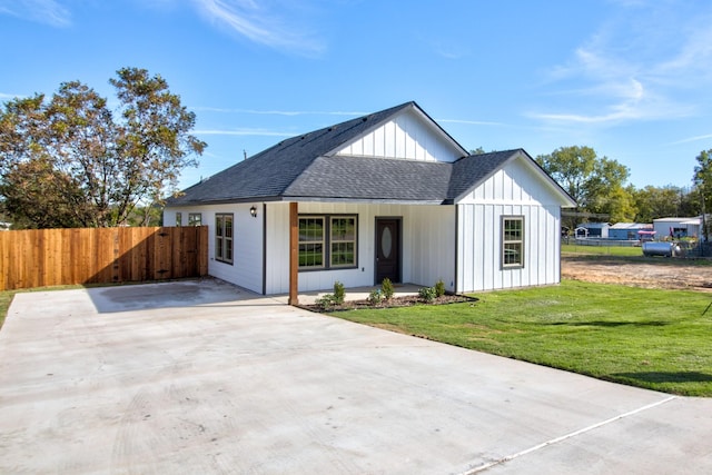 205 John Fielder, Sherman, TX 75092 - modern inspired farmhouse featuring roof with shingles, a porch, and board and batten siding