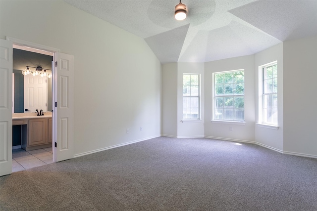 1526 Shadow Run, Weatherford, TX 76086 - spare room with light carpet, ceiling fan, and a textured ceiling