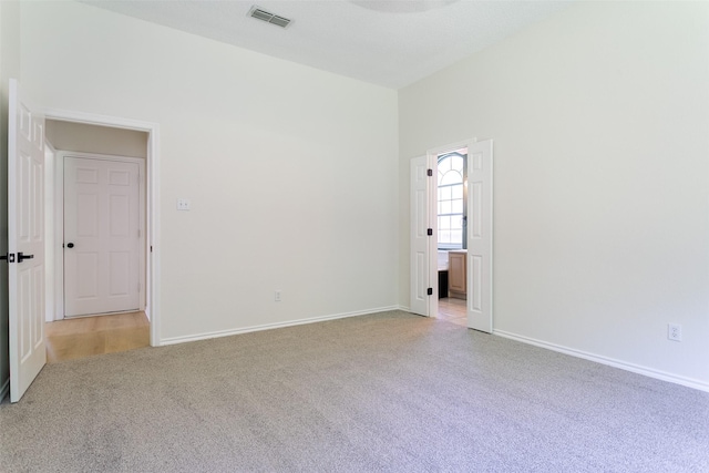 1526 Shadow Run, Weatherford, TX 76086 - spare room featuring light carpet and baseboards