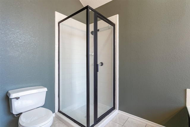 1526 Shadow Run, Weatherford, TX 76086 - full bath featuring a stall shower, a textured wall, and tile patterned floors