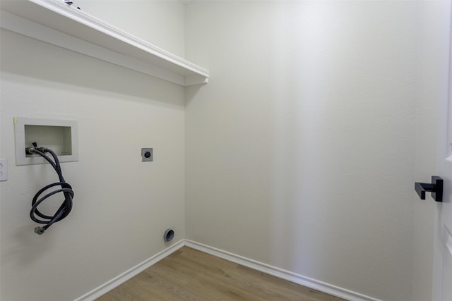 1526 Shadow Run, Weatherford, TX 76086 - washroom with washer hookup, light wood-style flooring, and hookup for an electric dryer