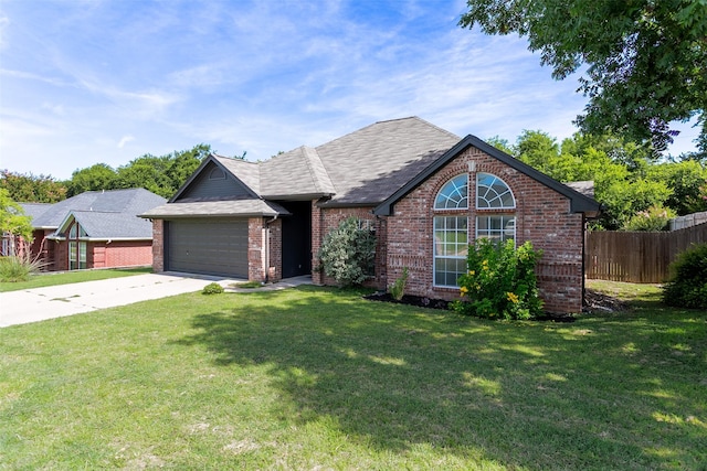 1526 Shadow Run, Weatherford, TX 76086 - view of front facade with driveway, a garage, brick siding, and a shingled roof