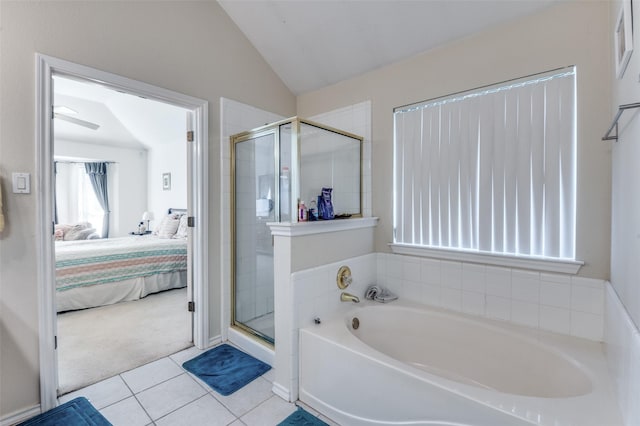 5615 Wellston Dr, Arlington, TX 76018 - full bathroom with ensuite bathroom, a garden tub, a stall shower, lofted ceiling, and tile patterned flooring