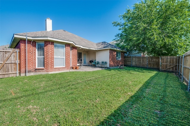 5615 Wellston Dr, Arlington, TX 76018 - rear view of property with brick siding, a fenced backyard, a patio area, a chimney, and a gate