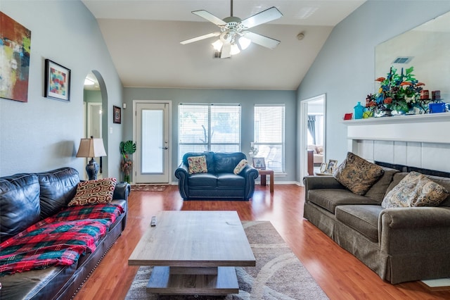 5615 Wellston Dr, Arlington, TX 76018 - living area with arched walkways, high vaulted ceiling, ceiling fan, and wood finished floors