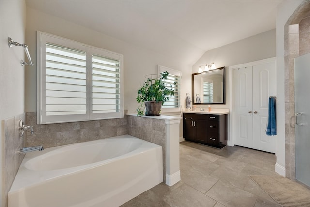 6159 Allatoona Rd, Fort Worth, TX 76179 - bathroom with vanity, a garden tub, lofted ceiling, and a stall shower