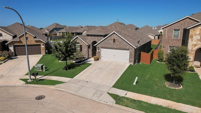 6159 Allatoona Rd, Fort Worth, TX 76179 - view of front of home featuring driveway, brick siding, a residential view, and a front yard