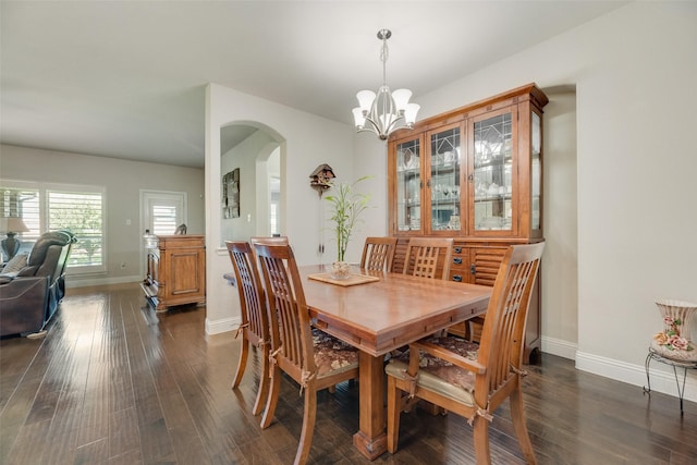 6159 Allatoona Rd, Fort Worth, TX 76179 - dining area featuring arched walkways, dark wood finished floors, and a chandelier
