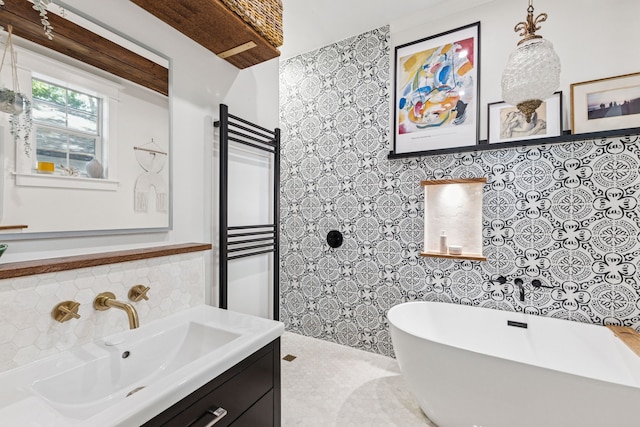 522 S Winnetka Ave, Dallas, TX 75208 - bathroom with a freestanding bath, vanity, tile walls, radiator heating unit, and backsplash