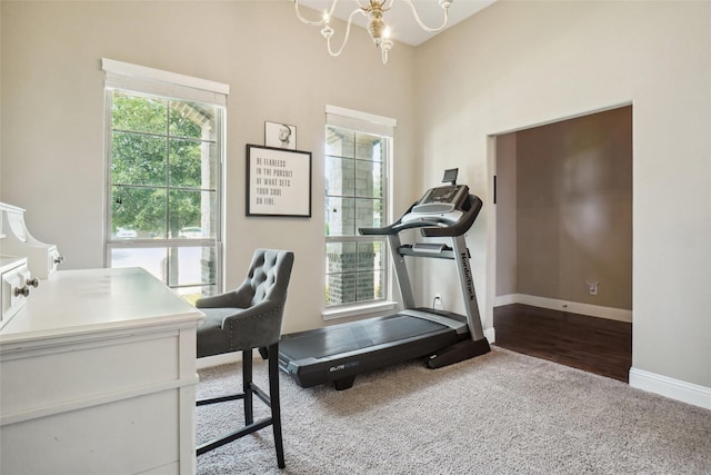 5009 Thistle Hl, Denton, TX 76210 - exercise room featuring carpet, a chandelier, plenty of natural light, and a high ceiling