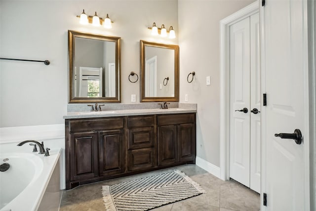 5009 Thistle Hl, Denton, TX 76210 - bathroom with double vanity, a bath, and a closet