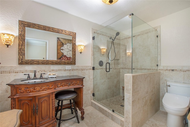 1202 Carroll Dr, Garland, TX 75041 - full bathroom featuring tile walls, vanity, a stall shower, wainscoting, and tile patterned floors